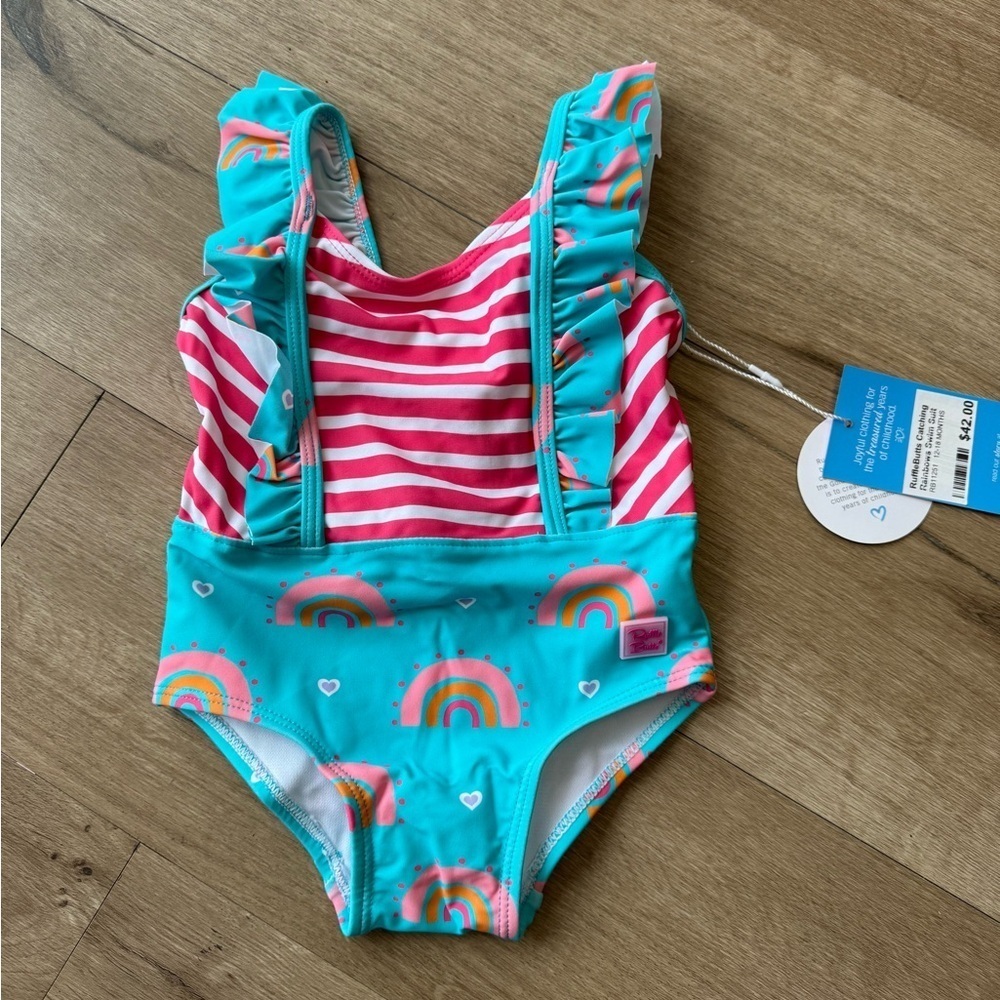 Ruffle Butts Rainbow Swimming Suit.  Girls size 6-12 months. New with tags!